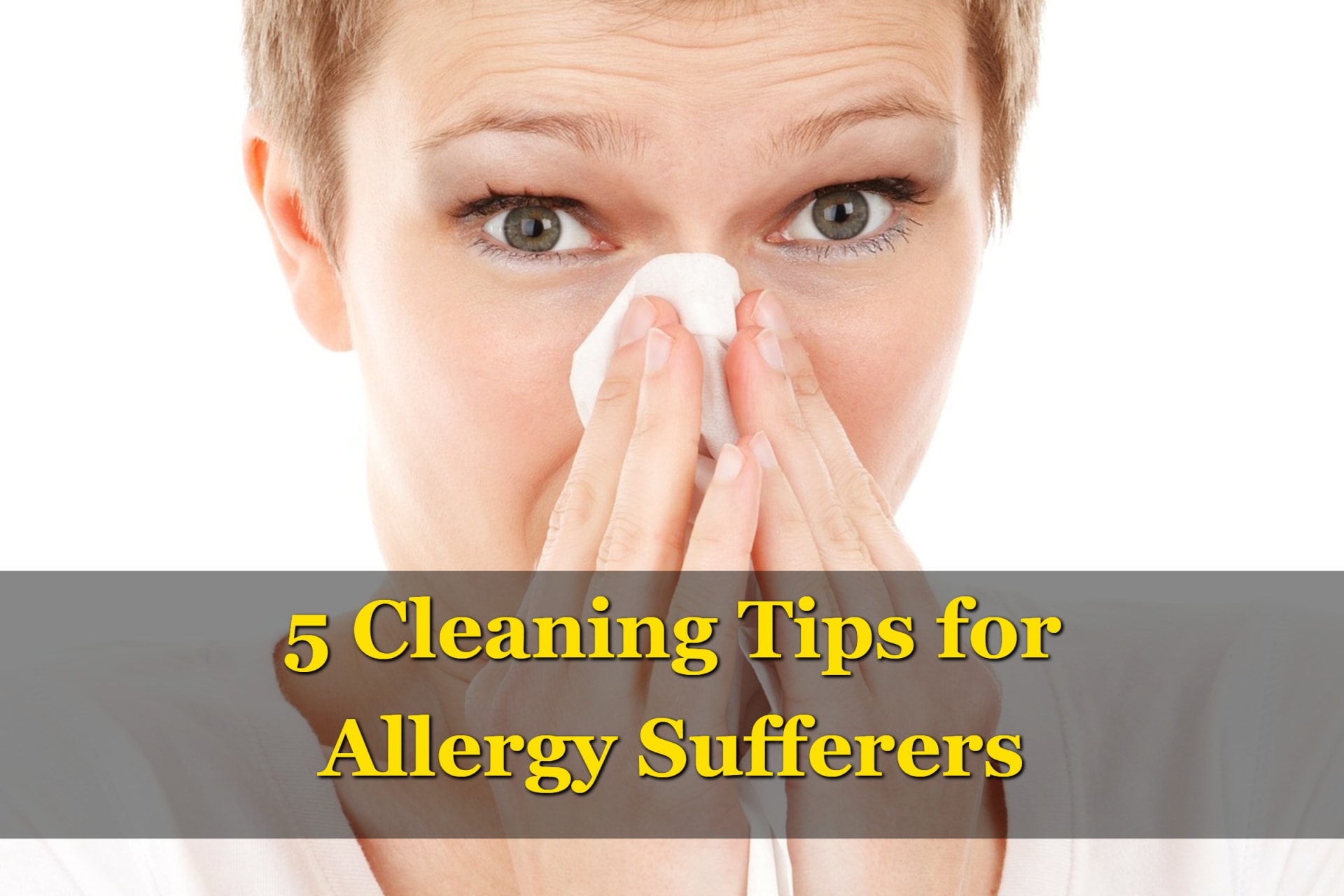 A woman blowing her nose and looking for cleaning tips for allergy sufferers.